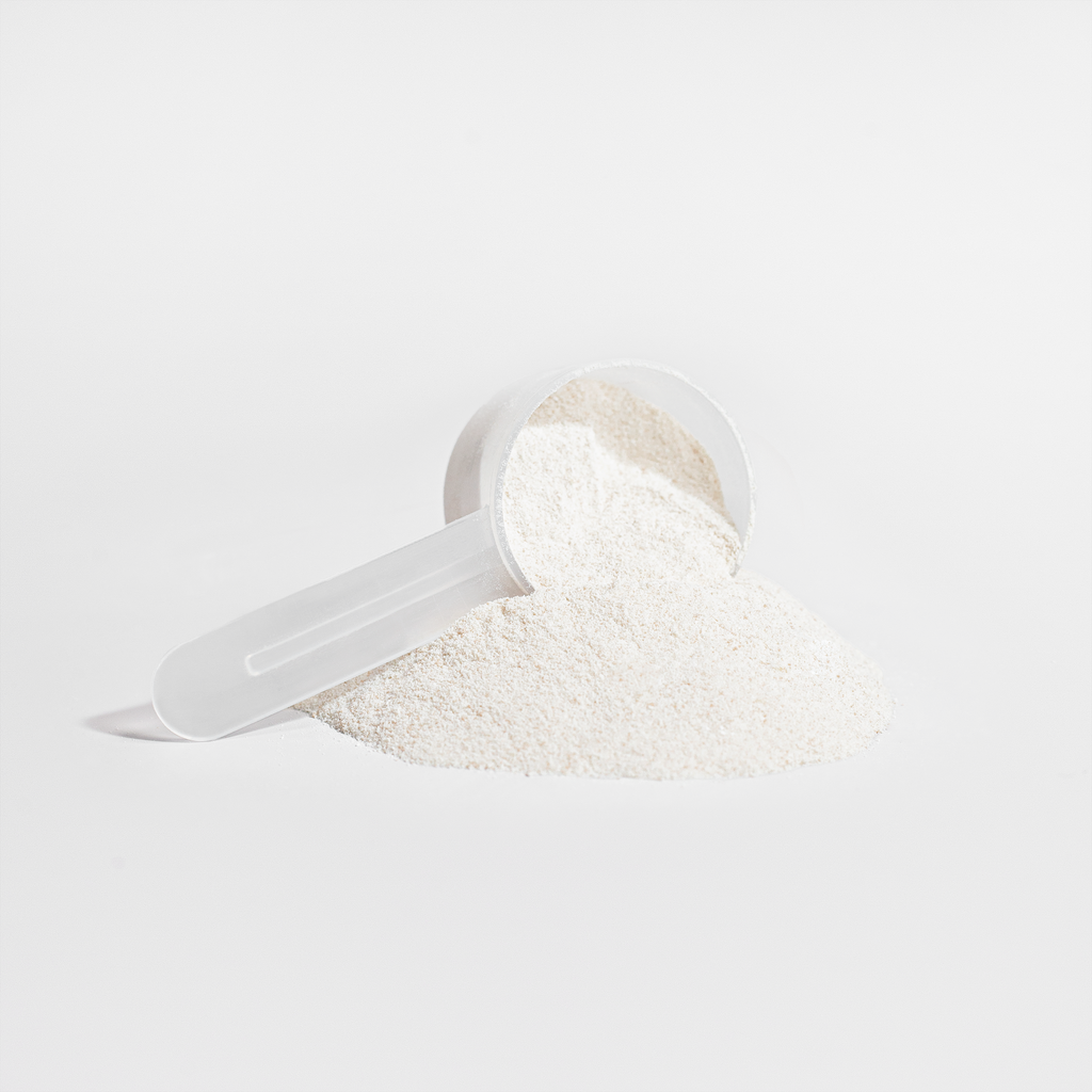 Scoop with a mound of Grass-Fed Collagen Building Peptides powder