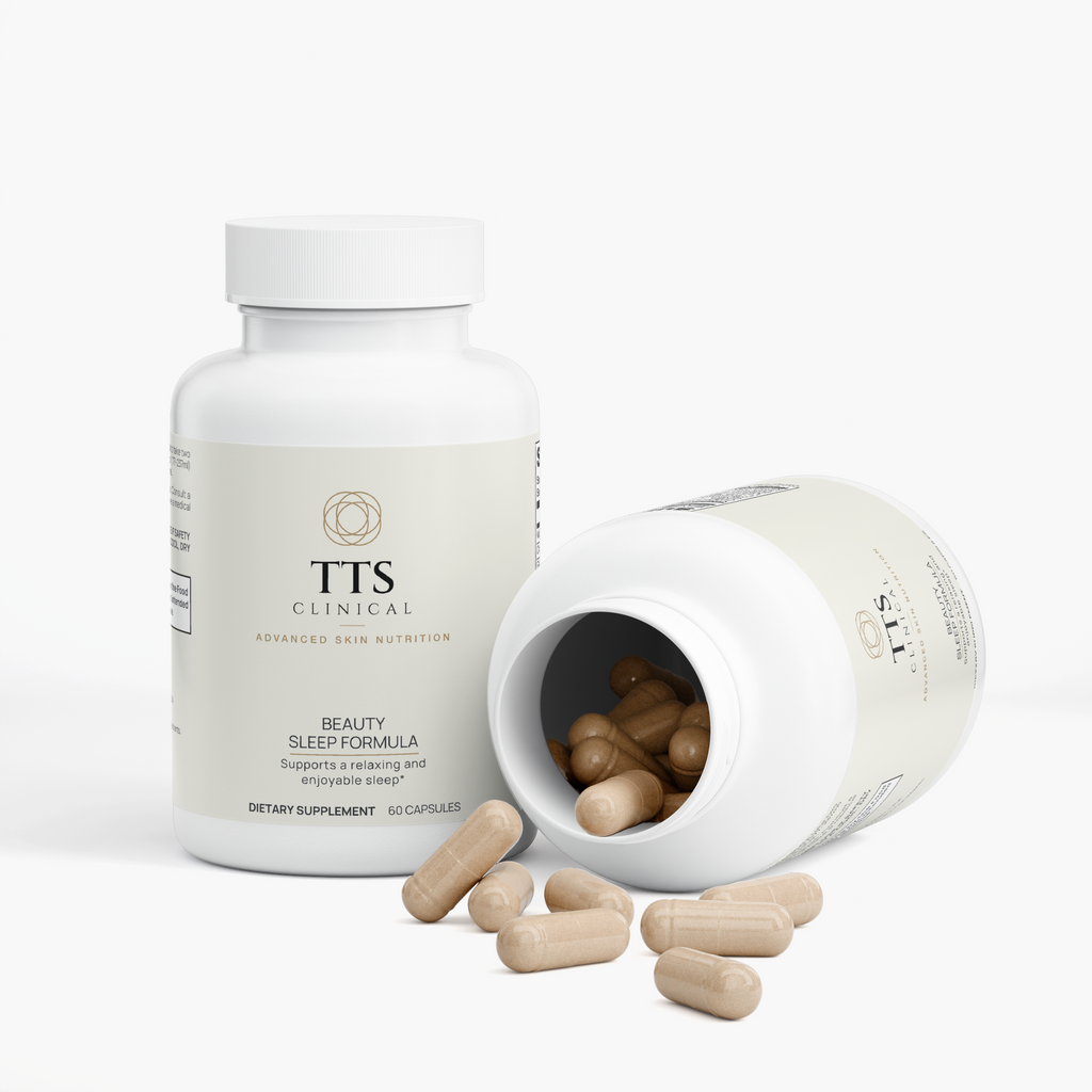 Two Beauty Sleep Formula bottles, one tipped open with capsules spilling out