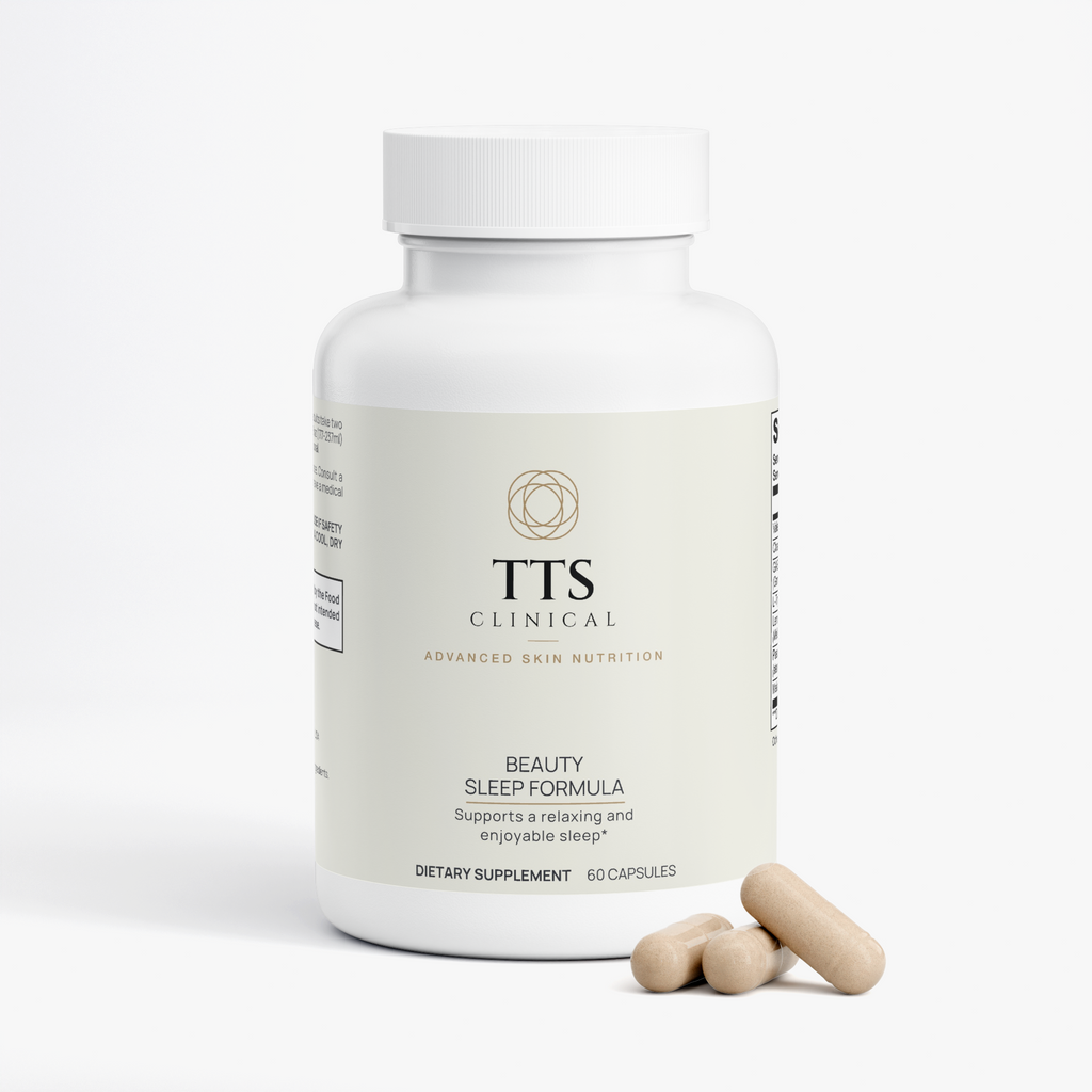 Beauty Sleep Formula bottle with three capsules beside it